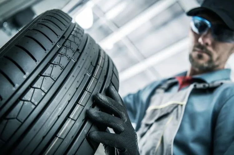 New car tires inspection by a mechanic